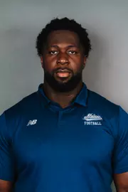 2026 Maine football roster head shot. Blue polo with Maine script.