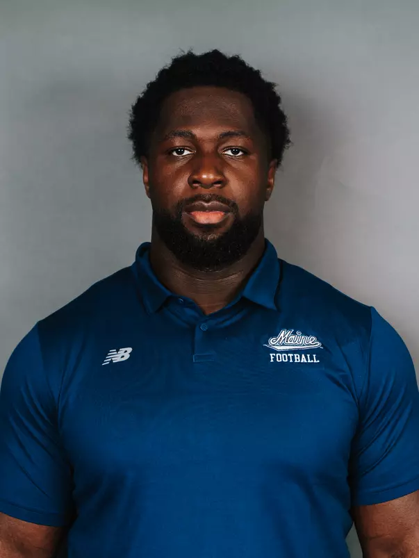 2026 Maine football roster head shot. Blue polo with Maine script.
