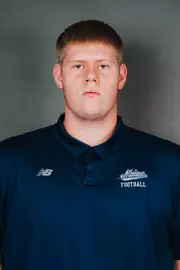 2026 Maine football roster head shot. Blue polo with Maine script.