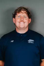 2026 Maine football roster head shot. Blue polo with Maine script.