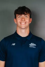 2026 Maine football roster head shot. Blue polo with Maine script.