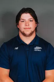 2026 Maine football roster head shot. Blue polo with Maine script.