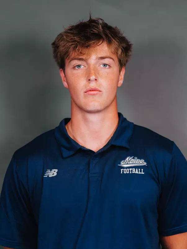 2026 Maine football roster head shot. Blue polo with Maine script.