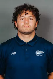 2026 Maine football roster head shot. Blue polo with Maine script.
