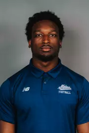 2026 Maine football roster head shot. Blue polo with Maine script.
