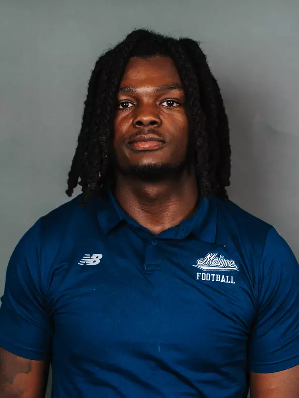 2026 Maine football roster head shot. Blue polo with Maine script.