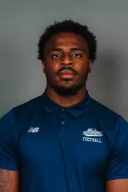 2026 Maine football roster head shot. Blue polo with Maine script.
