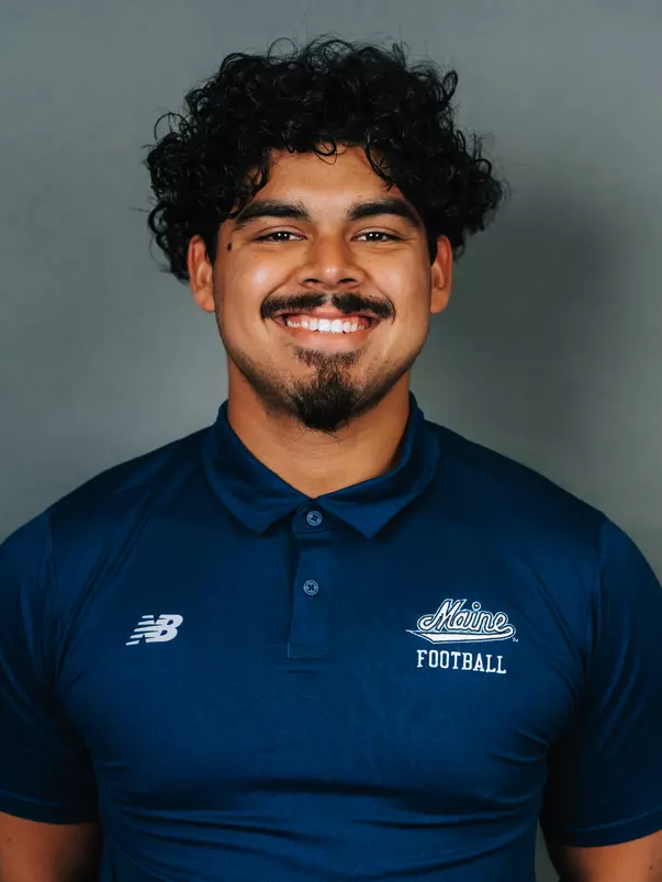2026 Maine football roster head shot. Blue polo with Maine script.