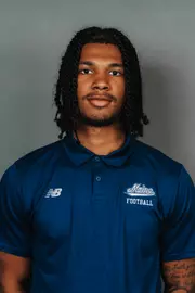 2026 Maine football roster head shot. Blue polo with Maine script.