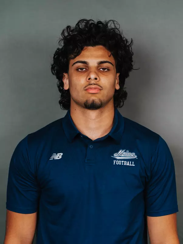 2026 Maine football roster head shot. Blue polo with Maine script.