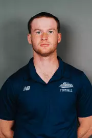 2026 Maine football roster head shot. Blue polo with Maine script.