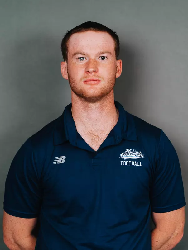 2026 Maine football roster head shot. Blue polo with Maine script.