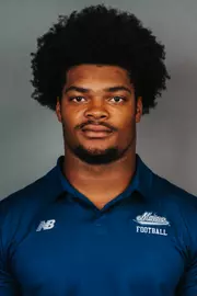 2026 Maine football roster head shot. Blue polo with Maine script.