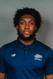 2026 Maine football roster head shot. Blue polo with Maine script.