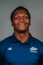 2026 Maine football roster head shot. Blue polo with Maine script.