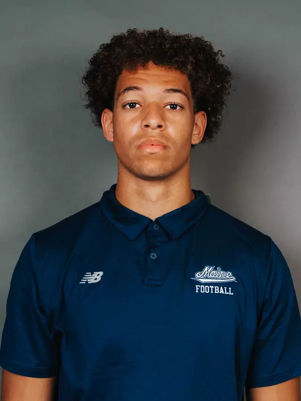 2026 Maine football roster head shot. Blue polo with Maine script.