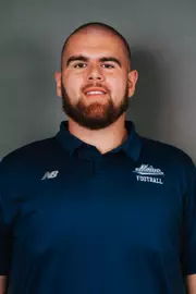 2026 Maine football roster head shot. Blue polo with Maine script.