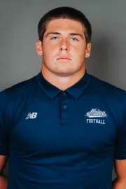 2026 Maine football roster head shot. Blue polo with Maine script.
