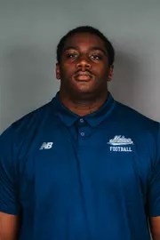 2026 Maine football roster head shot. Blue polo with Maine script.