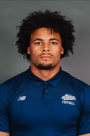 2026 Maine football roster head shot. Blue polo with Maine script.