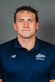 2026 Maine football roster head shot. Blue polo with Maine script.