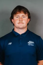 2026 Maine football roster head shot. Blue polo with Maine script.