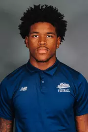 2026 Maine football roster head shot. Blue polo with Maine script.