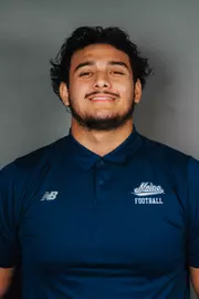 2026 Maine football roster head shot. Blue polo with Maine script.