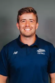 2026 Maine football roster head shot. Blue polo with Maine script.