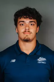 2026 Maine football roster head shot. Blue polo with Maine script.
