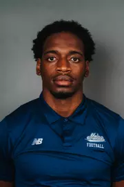 2026 Maine football roster head shot. Blue polo with Maine script.