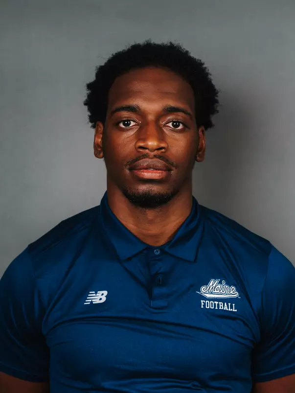 2026 Maine football roster head shot. Blue polo with Maine script.