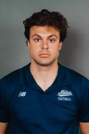 2026 Maine football roster head shot. Blue polo with Maine script.