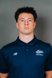 2026 Maine football roster head shot. Blue polo with Maine script.