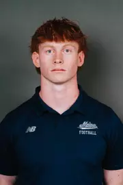 2026 Maine football roster head shot. Blue polo with Maine script.
