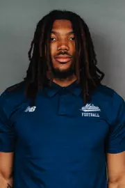 2026 Maine football roster head shot. Blue polo with Maine script.