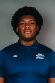 2026 Maine football roster head shot. Blue polo with Maine script.