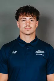 2026 Maine football roster head shot. Blue polo with Maine script.