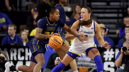 SIOUX FALLS, SD - MARCH 5: Zaire Harrell #24 of the Kansas City Roos drives towards the paint while guarded by Madison Mathiowetz #3 of the South Dakota State Jackrabbits at the 2026 Summit League Basketball Championship at the Denny Sanford Premier Center in Sioux Falls, South Dakota. (Photo by Dave Eggen/Inertia)