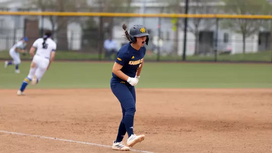 Elleana Navarro celebrates as she runs down the third base line to score a run in the Roos' 10-4 win over South Dakota State
