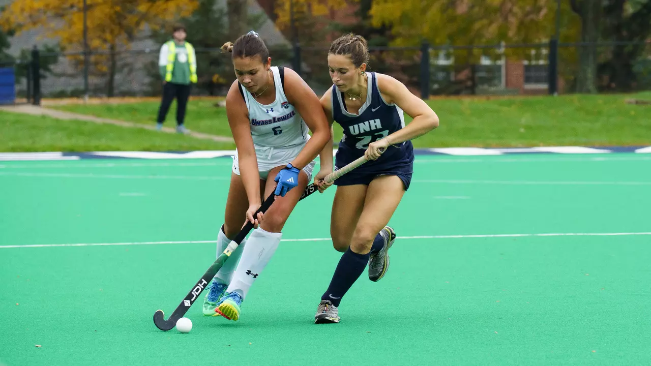 Rena Pistilli fighting for ball against UNH defender
