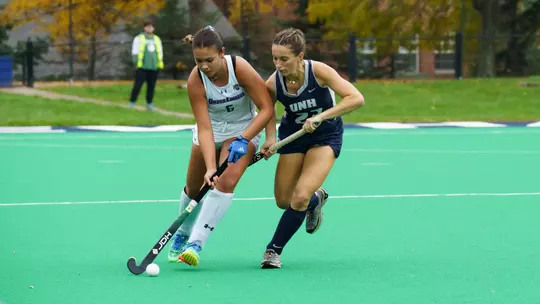 Rena Pistilli fighting for ball against UNH defender