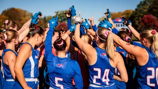 Field Hockey team huddling