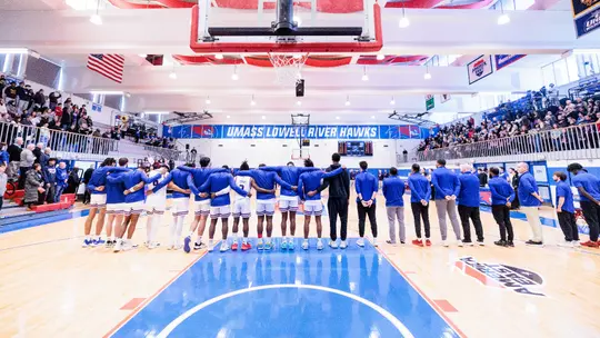 Men's Basketball Team lined up for national anthem