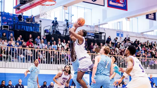 Victor Okojie taking a layup against Maine