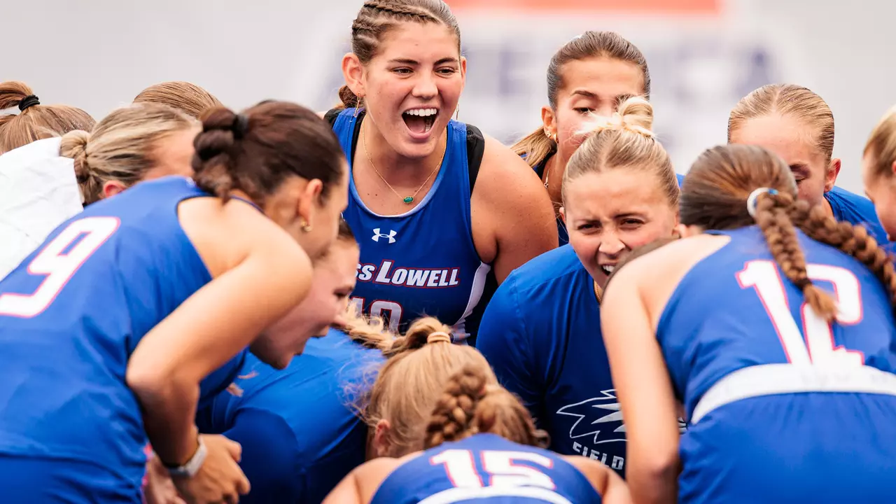Field Hockey team huddling