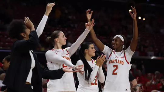 The Terps celebrate a 3-pointer against North Carolina in an exhibition game