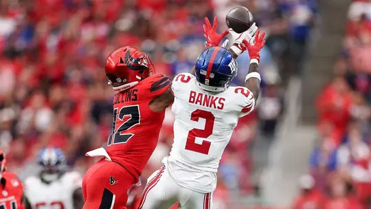 Former Terp Deonte Banks breaks up a pass against Nico Collins