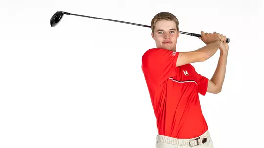 Emil Riegger posed with golf club