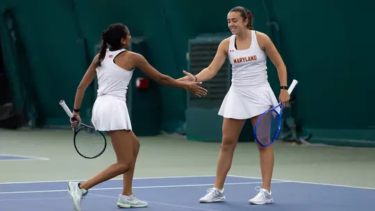 Emma Ghirardato and Diya Challa dapping each other up in 2025